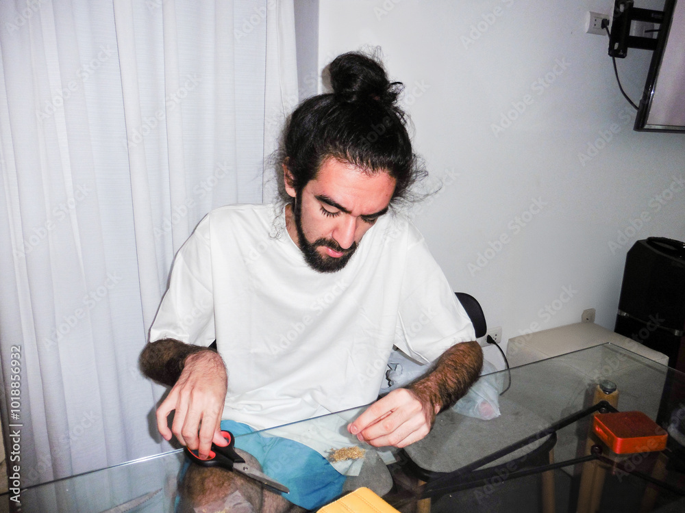 Man Chopping Weed With Scissors Man Chopping Weed With Scissors