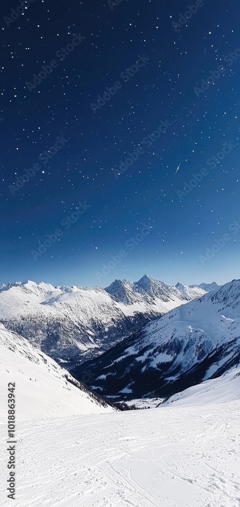 A tranquil winter night sky over snow-covered mountain peaks under bright stars A tranquil winter night sky over snow-covered mountain peaks under bright stars