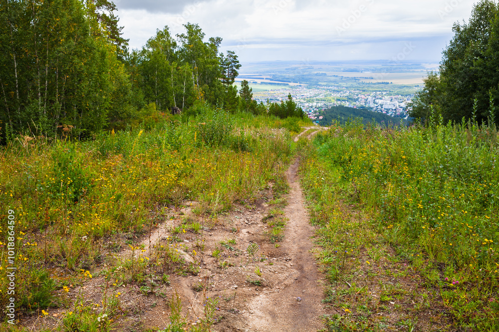 Rural Russian landscape with mountain road going down to Belokurikha Rural Russian landscape with mountain road going down to Belokurikha