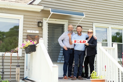 LGBTQ+ Realtor sells a couple and their children their first home.  photo