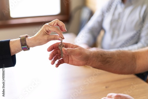Realtor Handing Over House Keys

