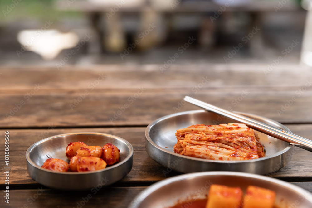 Closeup of picked vegetables served on metal plates at a restaurant in Seoul, Korea. Closeup of picked vegetables served on metal plates at a restaurant in Seoul, Korea.