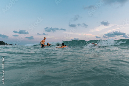 Family bodysurfing in the Gulf of Mexico photo