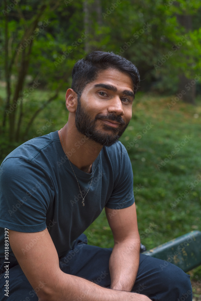 Relaxed camera aware portrait with kind Indian man Relaxed camera aware portrait with kind Indian man