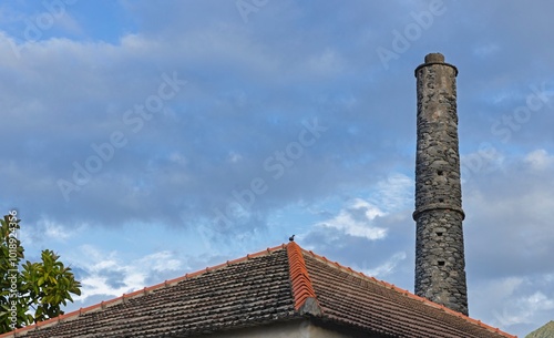 Rooftop and stone chimney at Porto da Cruz Madeira.  photo