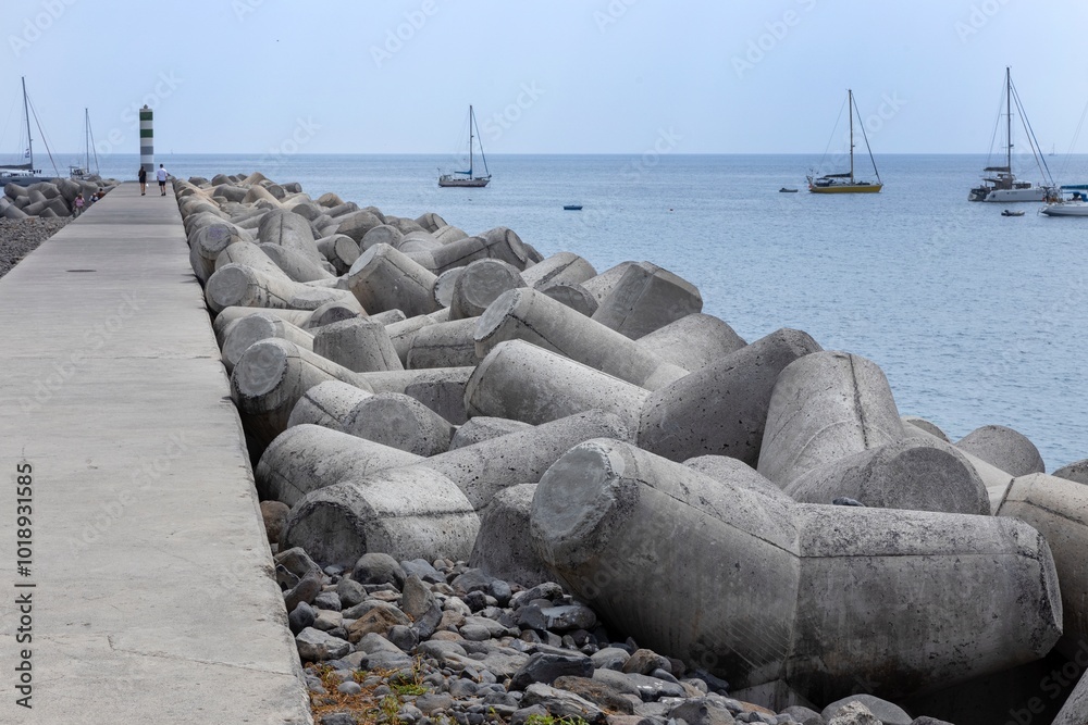 View on the harbor of Funchal. Madeira . Protection from the sea with blocks of concrete. View on the harbor of Funchal. Madeira . Protection from the sea with blocks of concrete.