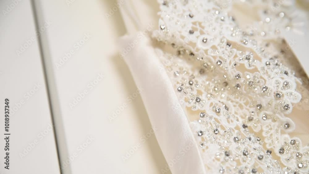 A white dress with pearls and diamonds. White dress of a bride for the wedding. An elegant dress A white dress with pearls and diamonds. White dress of a bride for the wedding. An elegant dress