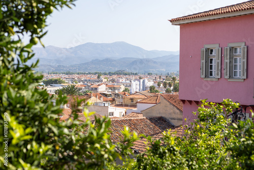 Wander through Nafplio, where colorful traditional houses harmonize with stunning mountain views, creating a picturesque atmosphere that captures Greece's timeless beauty.