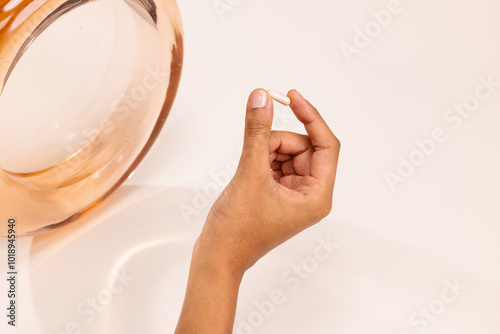 Hand Holding Supplement Pill 