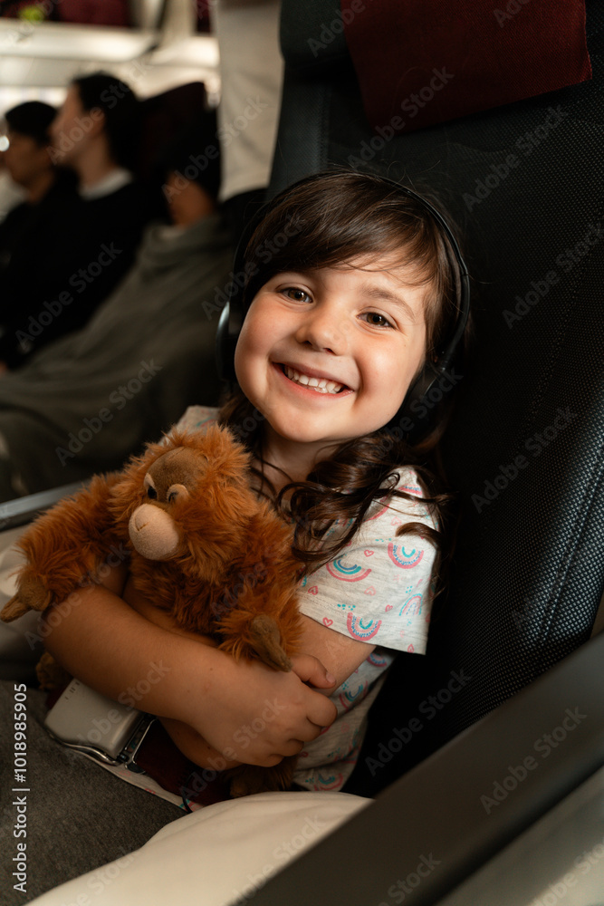 Happy Child Traveling by Plane with Toy. Family travel Happy Child Traveling by Plane with Toy. Family travel