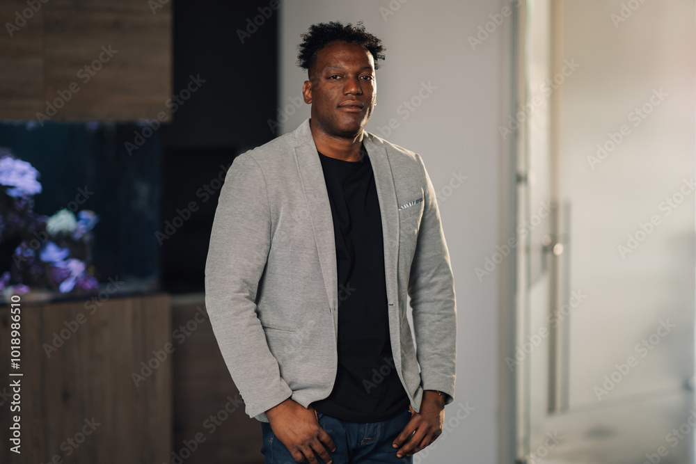Portrait of diverse confident executive standing at corporate office Portrait of diverse confident executive standing at corporate office