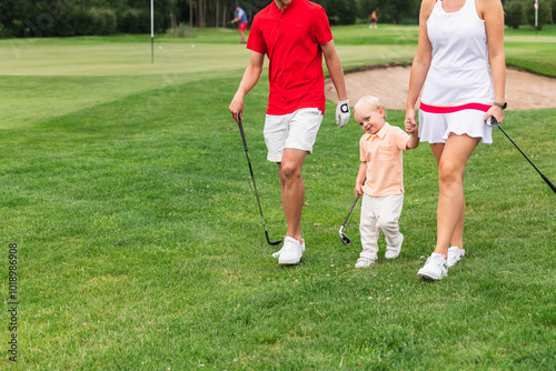 Family Walking with Young Son in Golf Field