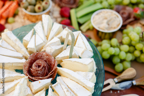 Meats and Cheese Sit out on Charcuterie Board at Wedding photo