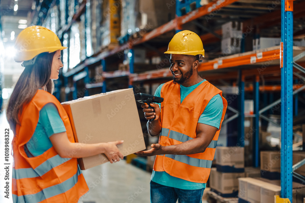 Warehouse workers scanning packages and managing inventory Warehouse workers scanning packages and managing inventory