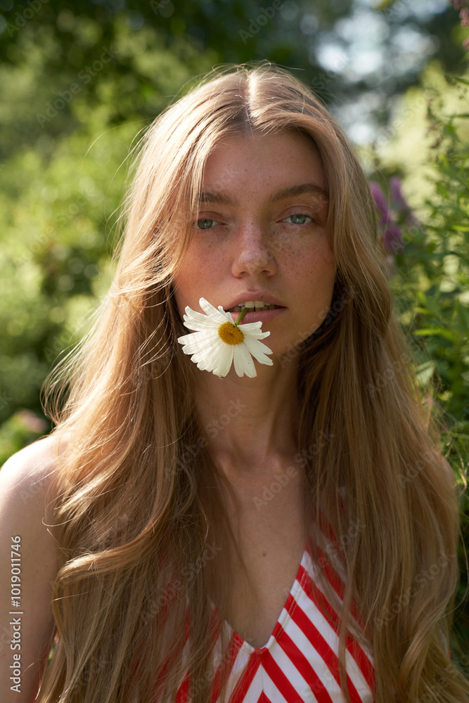 Young Woman With Flower in Garden During Daylight Young Woman With Flower in Garden During Daylight