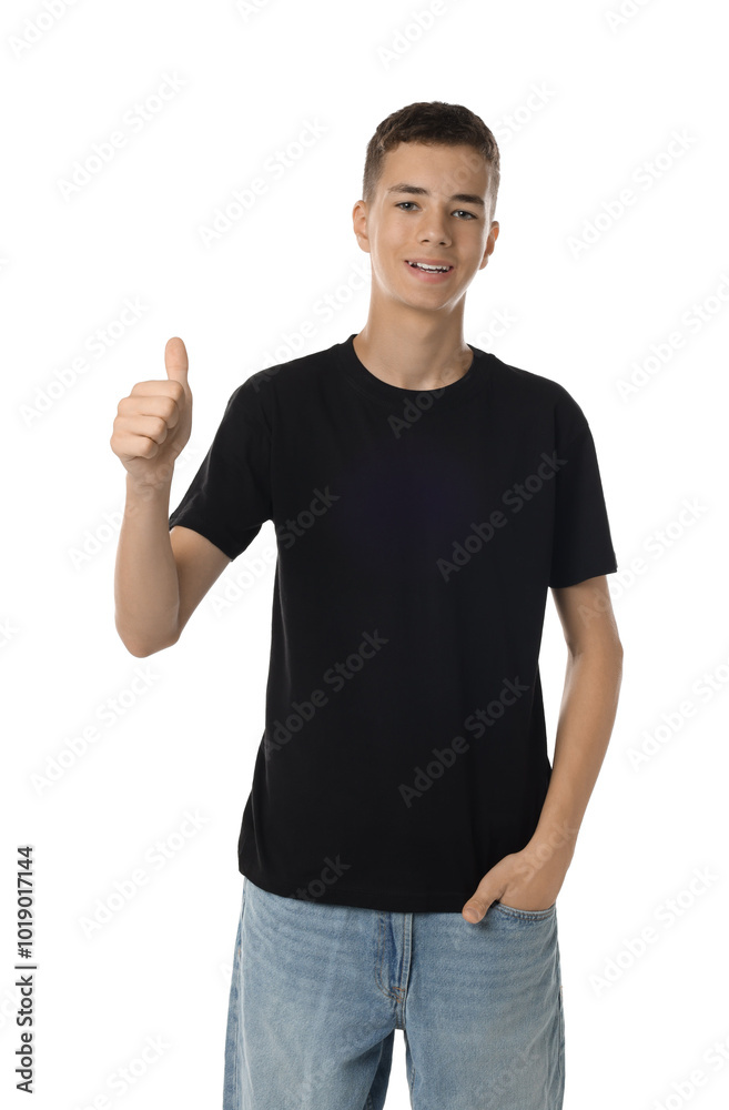 Teenage boy wearing black t-shirt and showing thumbs up on white background