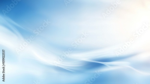 A soft and tranquil blue gradient with wispy white clouds during a serene morning in the sky