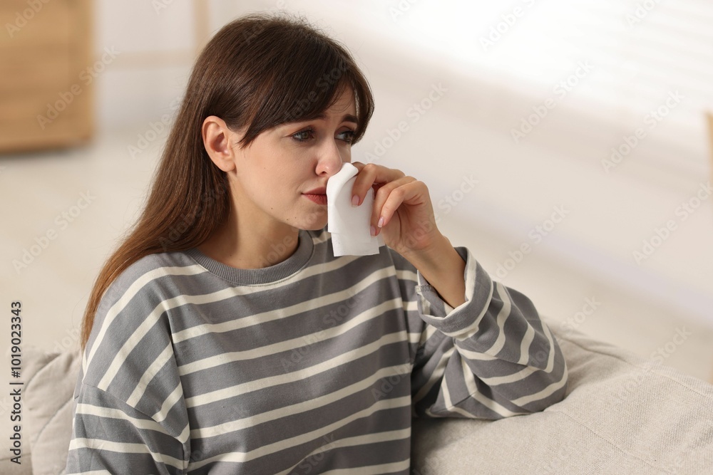 Woman with napkin suffering from sinusitis at home Woman with napkin suffering from sinusitis at home
