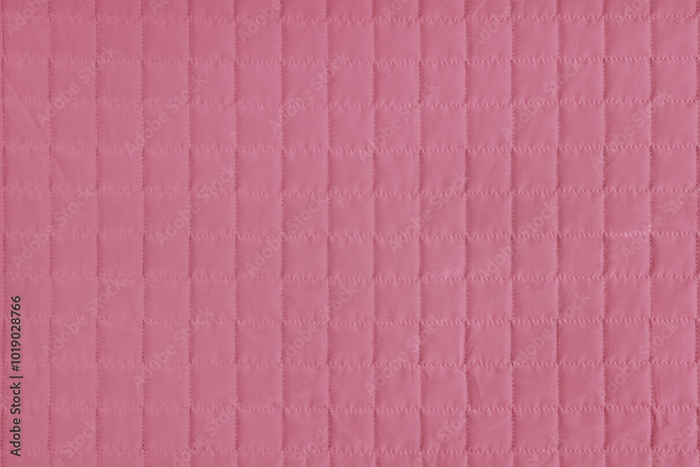 Fototapeta premium Checkered stitching pattern, pink quilted fabric background. Blanket stitch square texture