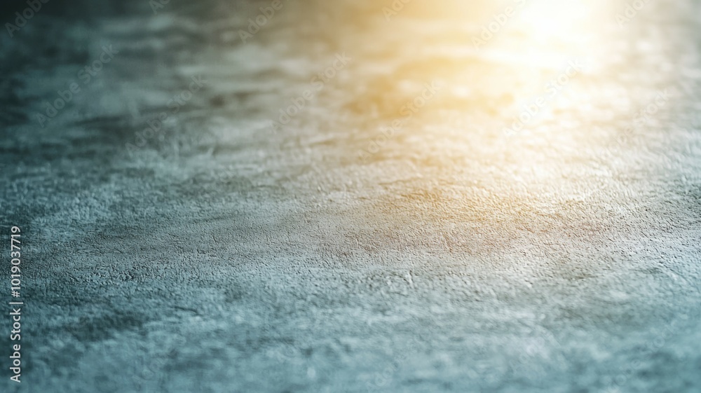 A grey and blue surface with a sun shining on it A grey and blue surface with a sun shining on it