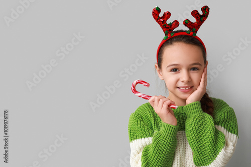 Cute little girl in reindee...