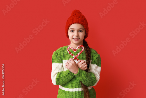 Cute little girl in warm ha...