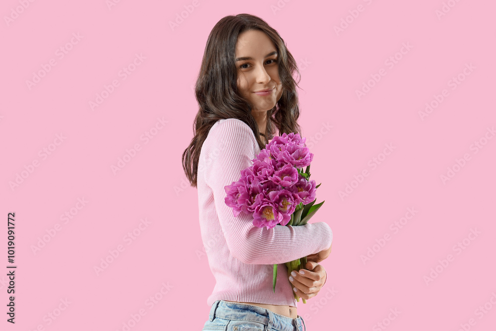 Young woman with tulips on pink background Young woman with tulips on pink background