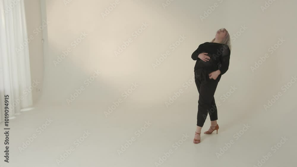 An Elegant Model Posing Gracefully in a Minimalist Studio Setting, Showcasing Beauty An Elegant Model Posing Gracefully in a Minimalist Studio Setting, Showcasing Beauty