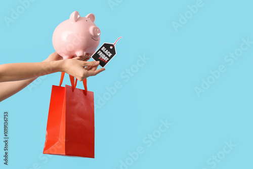 Female hands holding piggy ...
