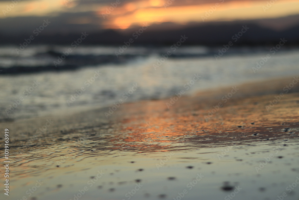 Sunset at sea. Balearic Sea, Salou, Spain. Beach, sea, small waves. Evening landscape on the coast. Vacation at sea Sunset at sea. Balearic Sea, Salou, Spain. Beach, sea, small waves. Evening landscape on the coast. Vacation at sea