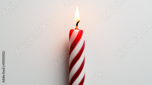 birthday candle concept image: red and white striped candle, top down view, a single birthday candle placed in the center of a white background