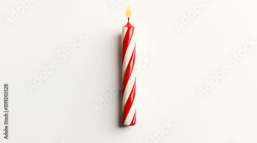 birthday candle concept image: red and white striped candle, top down view, a single birthday candle placed in the center of a white background