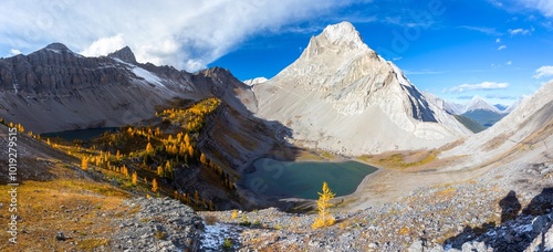 Kananaskis Country Alberta Hiking Canadian Rockies.  Autumn Larch Trees Colours Landscape Panorama.  Emerald Green Lakes Smuts Mountain Peak Blue Sky photo