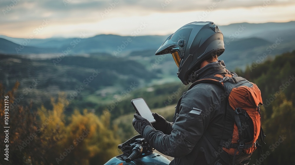 Motorcyclist enjoying the mountain view Motorcyclist enjoying the mountain view