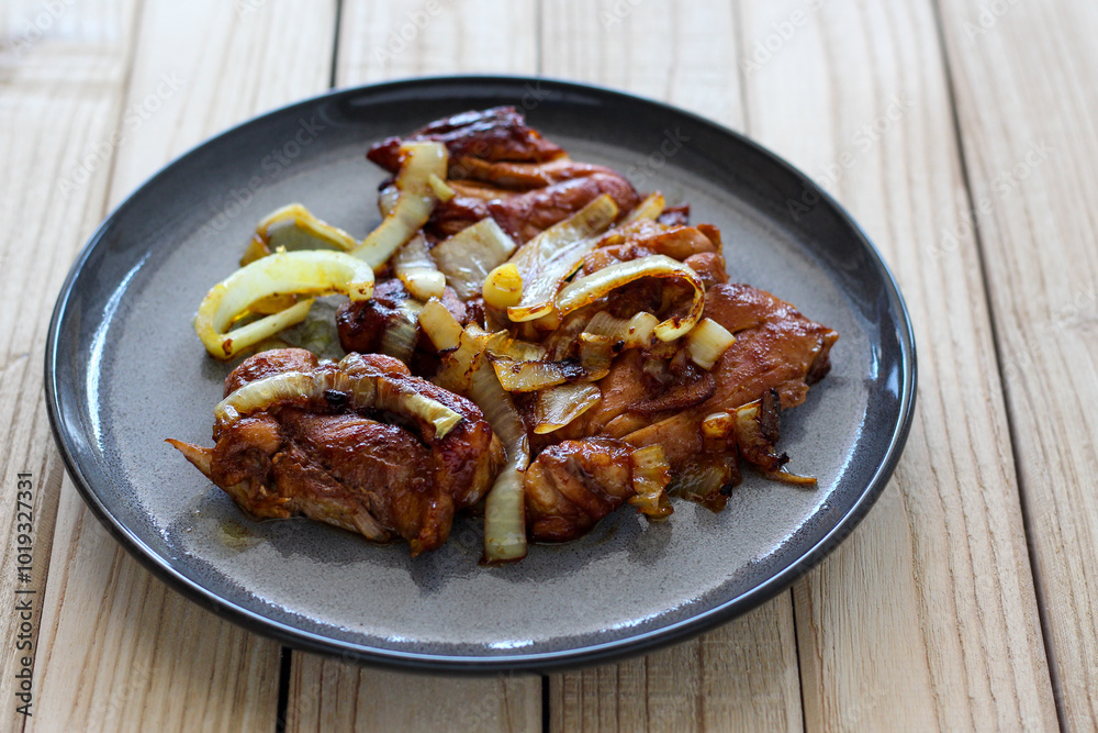Grilled chicken with onion. Perfect for recipe, article, catalogue, or any commercial purposes.