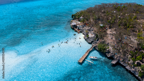 Fototapeta Naklejka Na Ścianę i Meble -  Aerial view of Sumilon Island, Oslob, Cebu, Philippines, White sand beach and seashore at Sumilon island beach, Sand beach clear sea water of the Sumilon Island, Oslob, Cebu, Philippines.