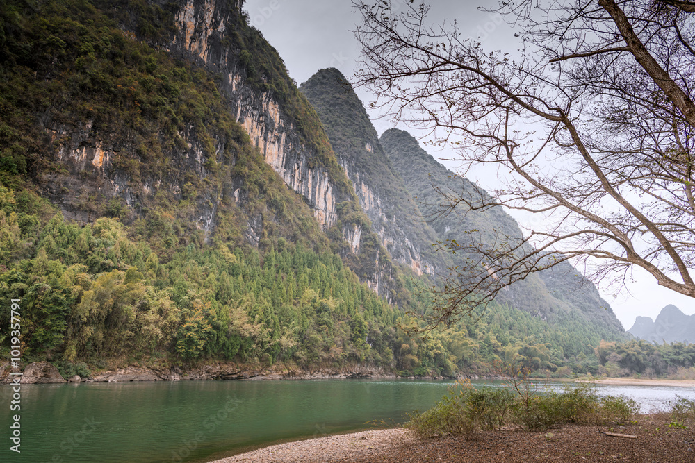 Dramatic sky over Guilin landscape and a river bend near Xingping, China Dramatic sky over Guilin landscape and a river bend near Xingping, China