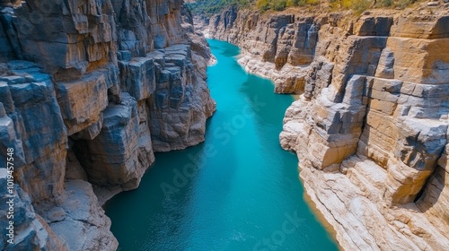 Aerial View of Turquoise River Winding Through a Rocky Canyon