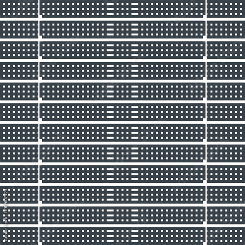 Dense horizontal plates with small holes in the form of a partition or wall.