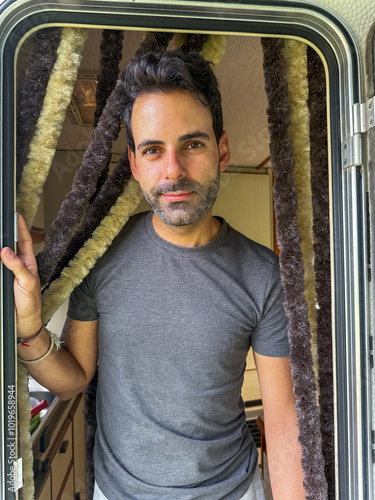 portrait of a man at the door of his motorhome photo