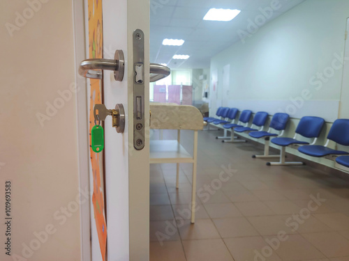 Empty corridor in hospital with chairs. Hospital hallway.	