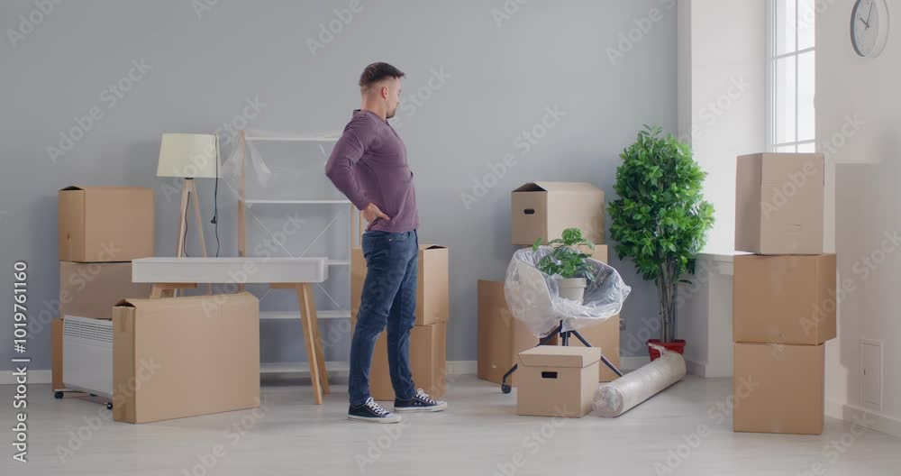 Man enjoys moving new apartment, happy cardboard carrying, excited homebuyer transporting boxes, organizing new home move, changing residence for better, male independence, adult family life beginning
