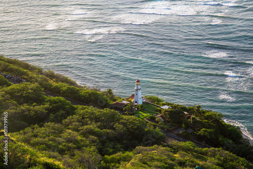 Honolulu, Oahu, Hawaii, USA - December 16, 2019: Aerial view of a lighthouse at US Coast Guard near Waikiki Beach seen from Diamond Head photo