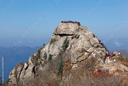 Jangam-ri, Sangju-si, Gyeongsangbuk-do, Korea - November 3, 2013: Hickers are on top(Munmundae) of autumnal Songnisan Mt, a national park. photo