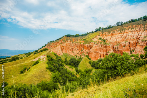 Red rocky slopes Rapa Rosie is a protected geological and floristic reservation area near Sebes alba in Romania photo