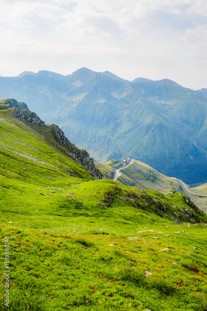 Hiking in Fagaras mountains on Iezerul Caprei peak over Transfagarasan serpentine road carpathian mountains. Mountains landscape Hiking in Fagaras mountains on Iezerul Caprei peak over Transfagarasan serpentine road carpathian mountains. Mountains landscape
