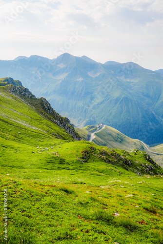 Hiking in Fagaras mountains on Iezerul Caprei peak over Transfagarasan serpentine road carpathian mountains. Mountains landscape photo