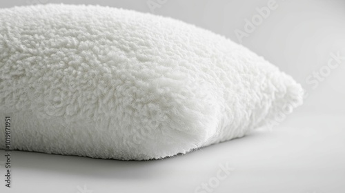 Close-up of a White Fluffy Pillow on a White Background