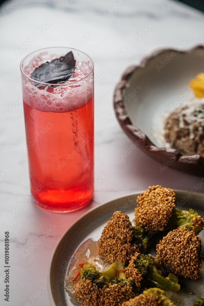 Plate of Fried Broccoli with Red Lemonade Plate of Fried Broccoli with Red Lemonade