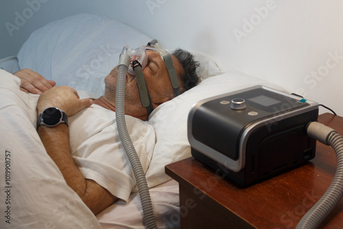 Man Sleeping with CPAP Machine for Sleep Apnea